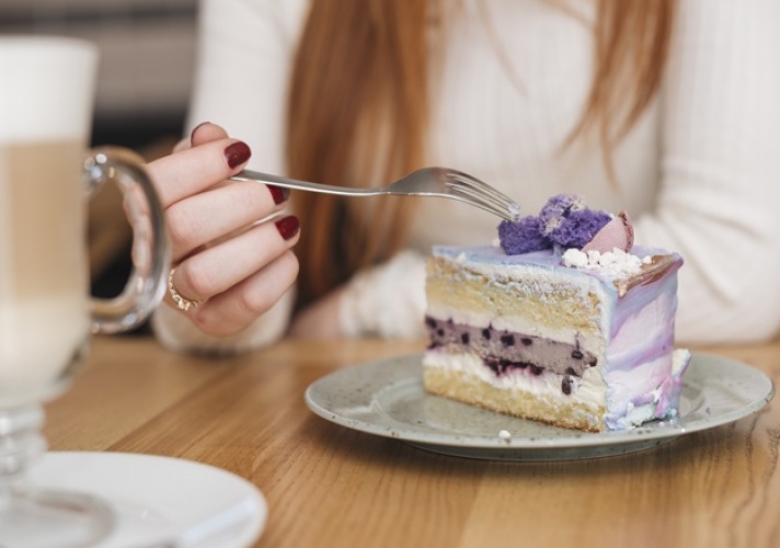 gallery/close-up-woman-with-fork-delicious-blueberry-cake-slice-plate-wooden-table_23-2148161756
